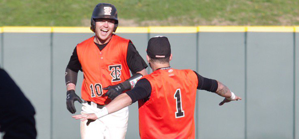 Zack Finchum celebrates his walk-off double in the first game as Tusculum and Winston-Salem split a DH Thursday (photo by Chris Lenker).