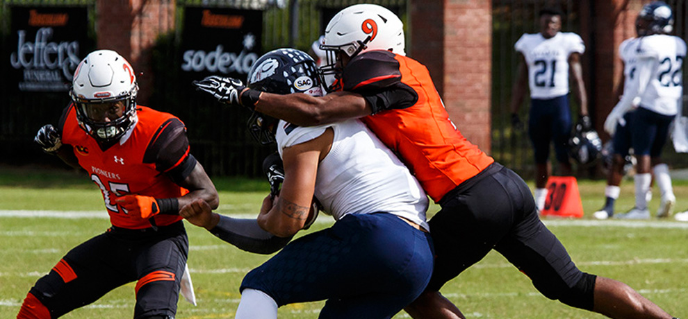 Tusculum's L'Keith Brown (9) records one of his team-best 9 tackles against Catawba (photo by Chuck Williams)