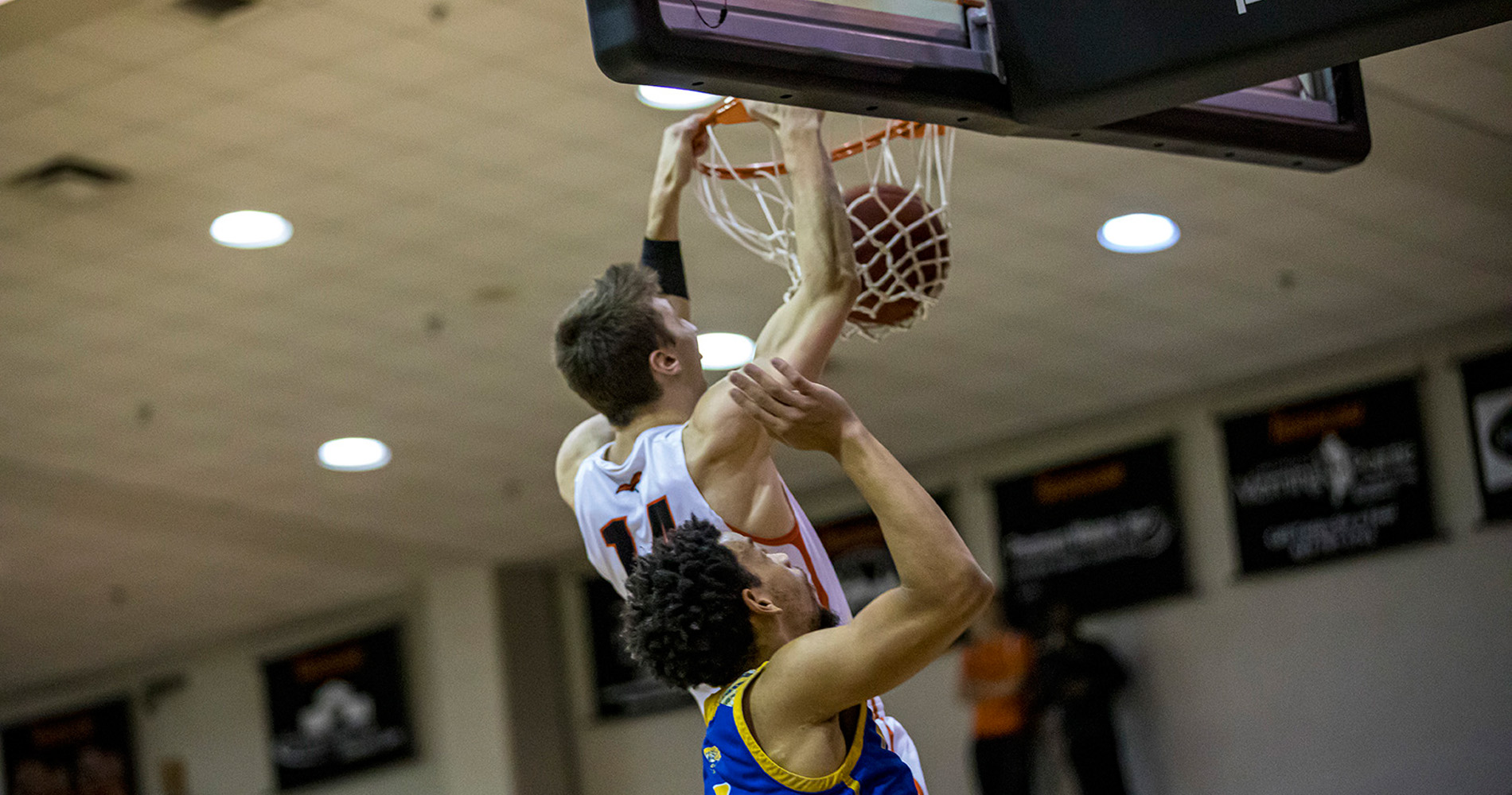 Caleb Hodnett slams this dunk home in Tusculum's 80-66 home win over Mars Hill (photo by Chuck Williams)