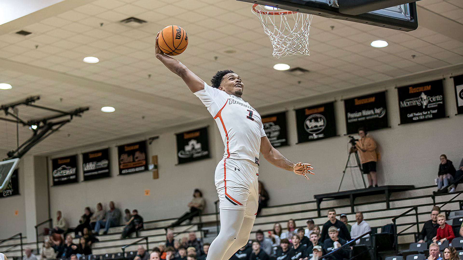 Justin Mitchell dunks home two of his season-high 17 points in Tusculum's game with Emory & Henry (photo by Chuck Williams)