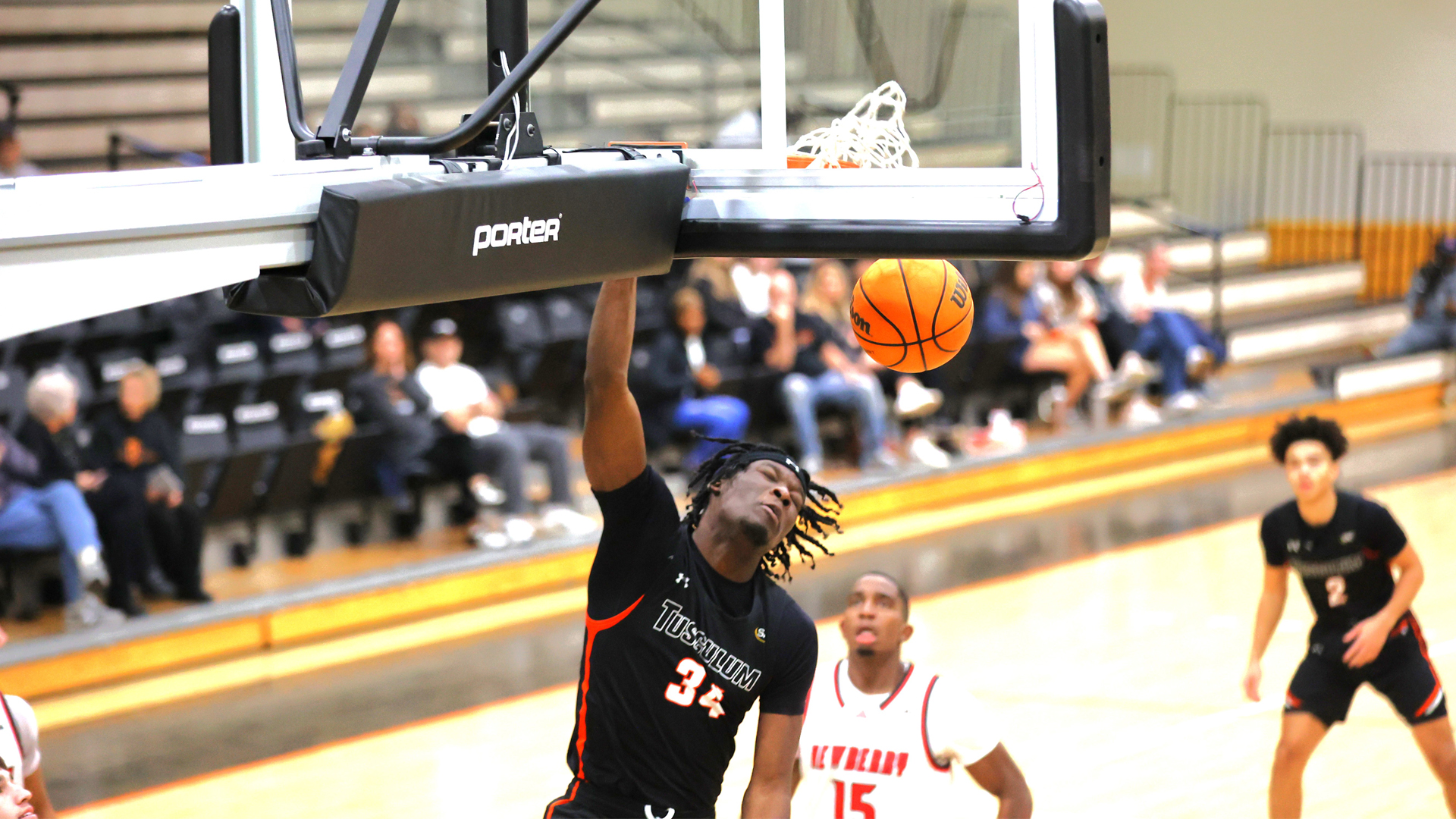 Tusculum's Akeem Odusipe puts down this dunk as the Pioneers win 73-62 over Newberry (photo by Brandon Johnson).