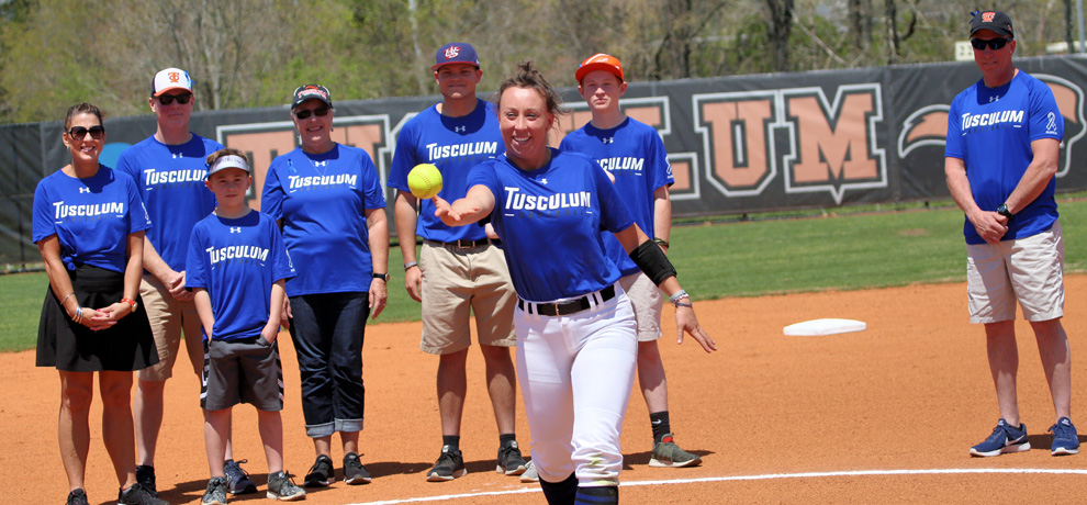 Emily White throws out the first pitch as part of Alopecia Awareness Day. The team wore blue uniforms in honor of Emily.