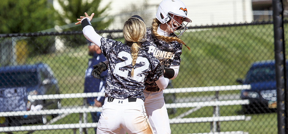 Brittney Franse celebrates with Morgan Mahaffey after drawing the game-ending walk (photo by Chuck Williams)