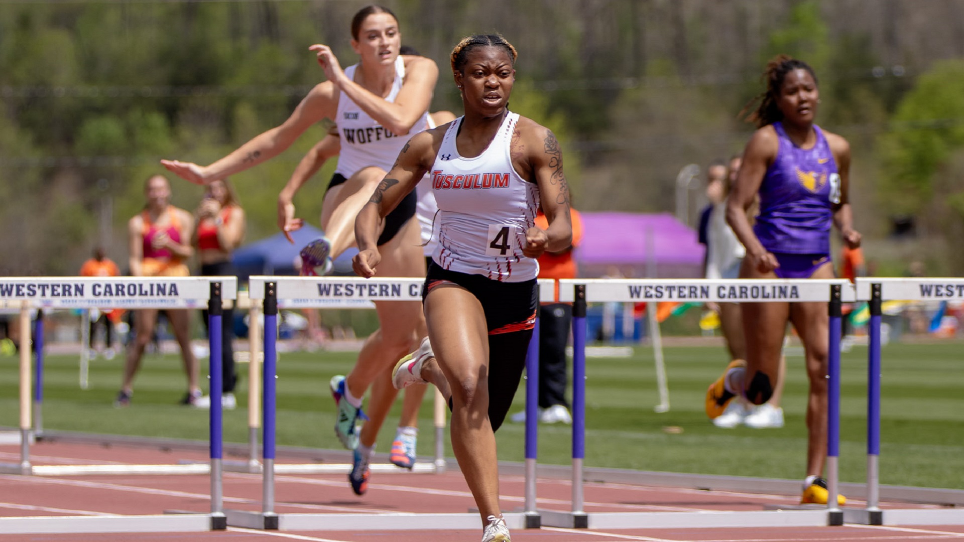 Theresa Green-White breaks her own school record in the 100 hurdles (photo by Kari Ham)