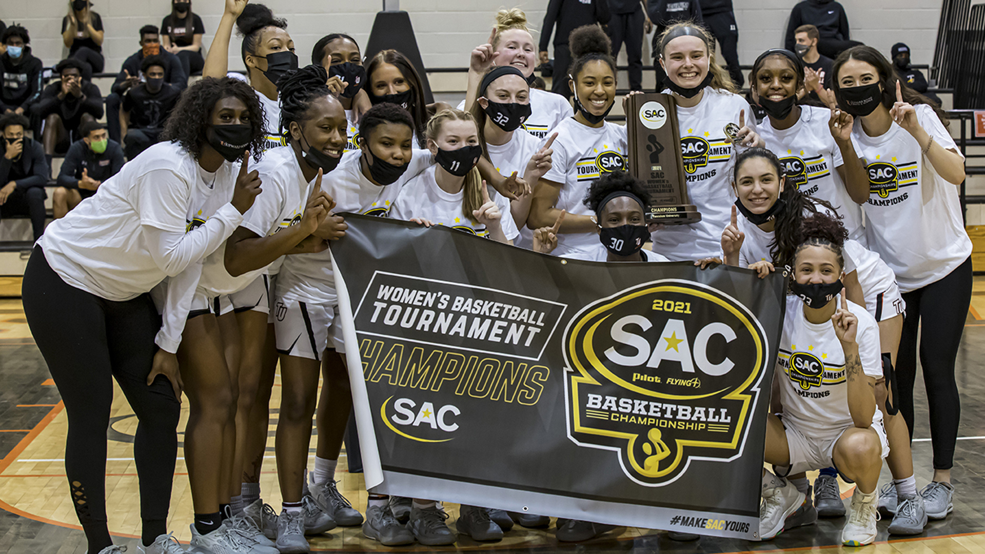 The Pioneers celebrate their second straight SAC Championship victory (photo by Chuck Williams)