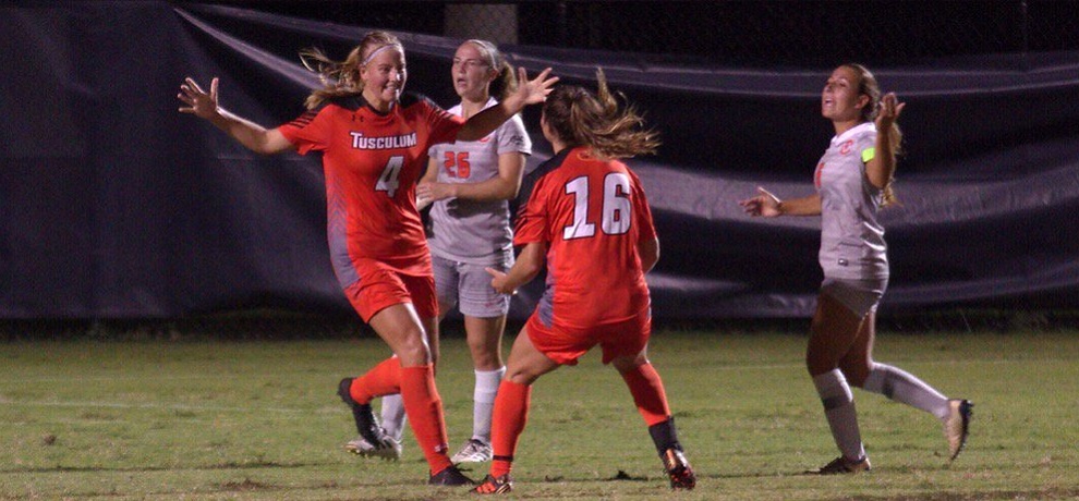 Yvette Raaijen (left) celebrates her penalty kick goal with Kate Guildford, who scored the second goal for the Pioneers (photo by Chris Lenker)