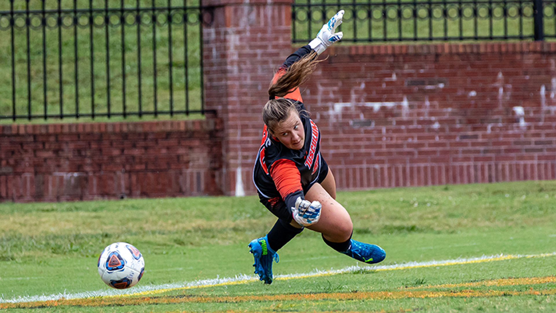 Emma Harriman got a glove on this shot for one of her five saves against Mars Hill (photo by Chuck Williams)