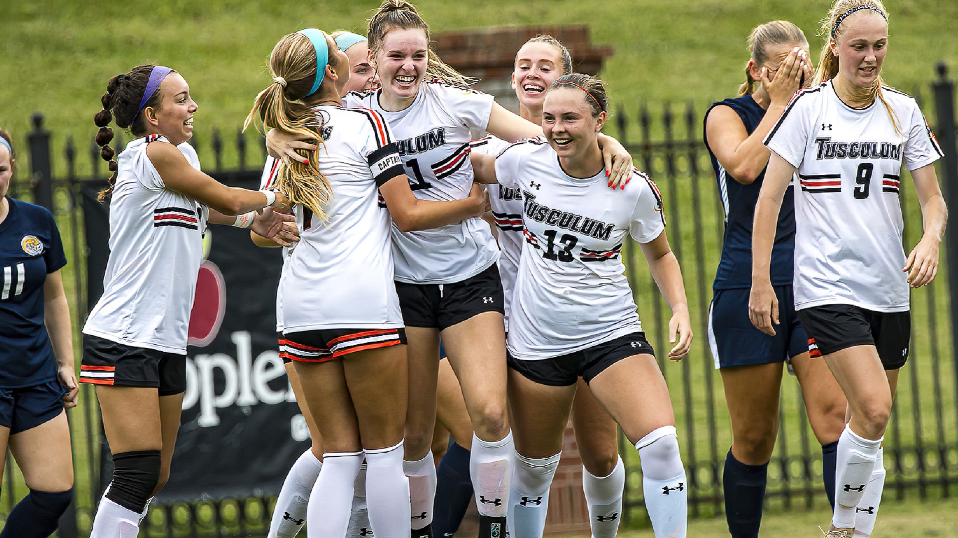 Brynn Stokes celebrates with her teammates after scoring the first goal of the match (photo by Chuck Williams)