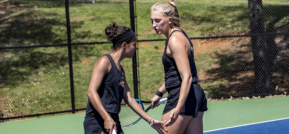 Brittani Brooks (left) and Emilie Hansen rallied from 2-5 down to win their doubles match (photo by Chuck Williams)