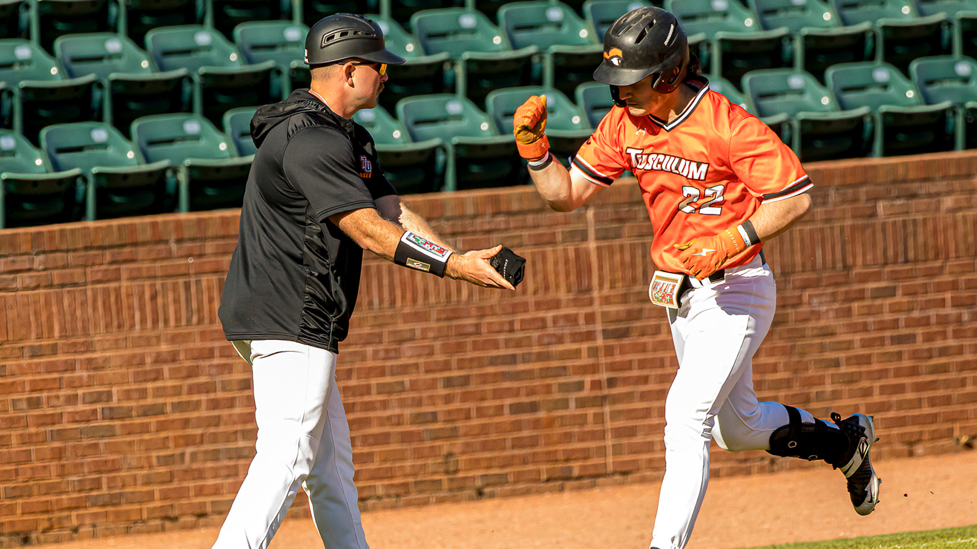 Zane Keener celebrates his grand slam in the 3rd inning as Tusculum defeats Cedarville (Photo by Chuck Williams)