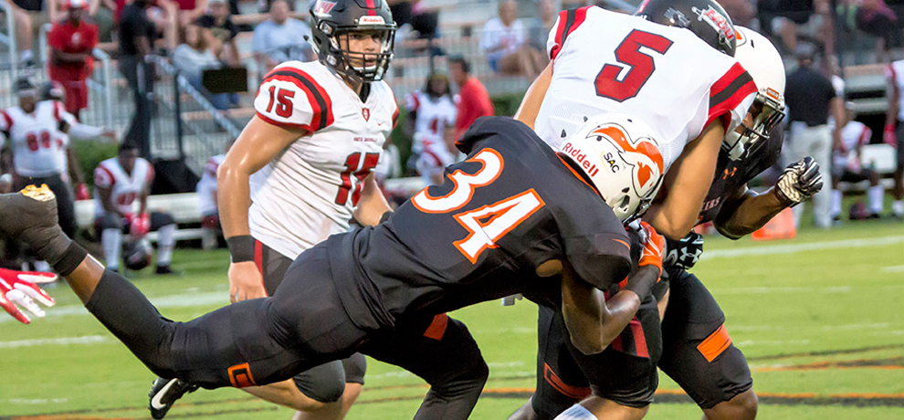 CJ Bartley applying the defensive pressure in Thursday's opener with North Greenville (photo by Chuck Williams)