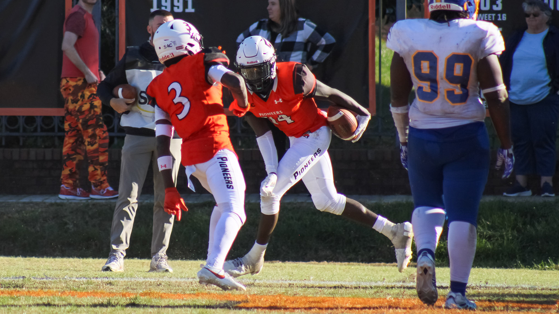 Brothers Kemani Brown and Zaron Collins celebrate after scoring the game-winning two-point conversion in Tusculum's 29-27 double OT win over Mars Hill (photo by Kari Ham)