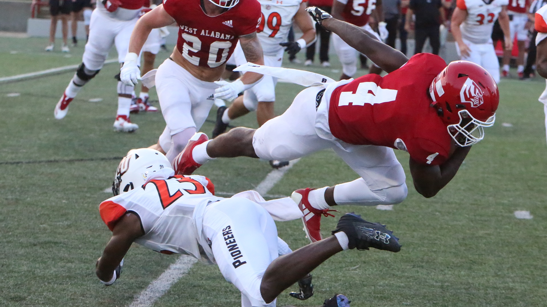 Marquel Pittman trips up ball carrier Devontae Causey (photo by Dom Donnelly)