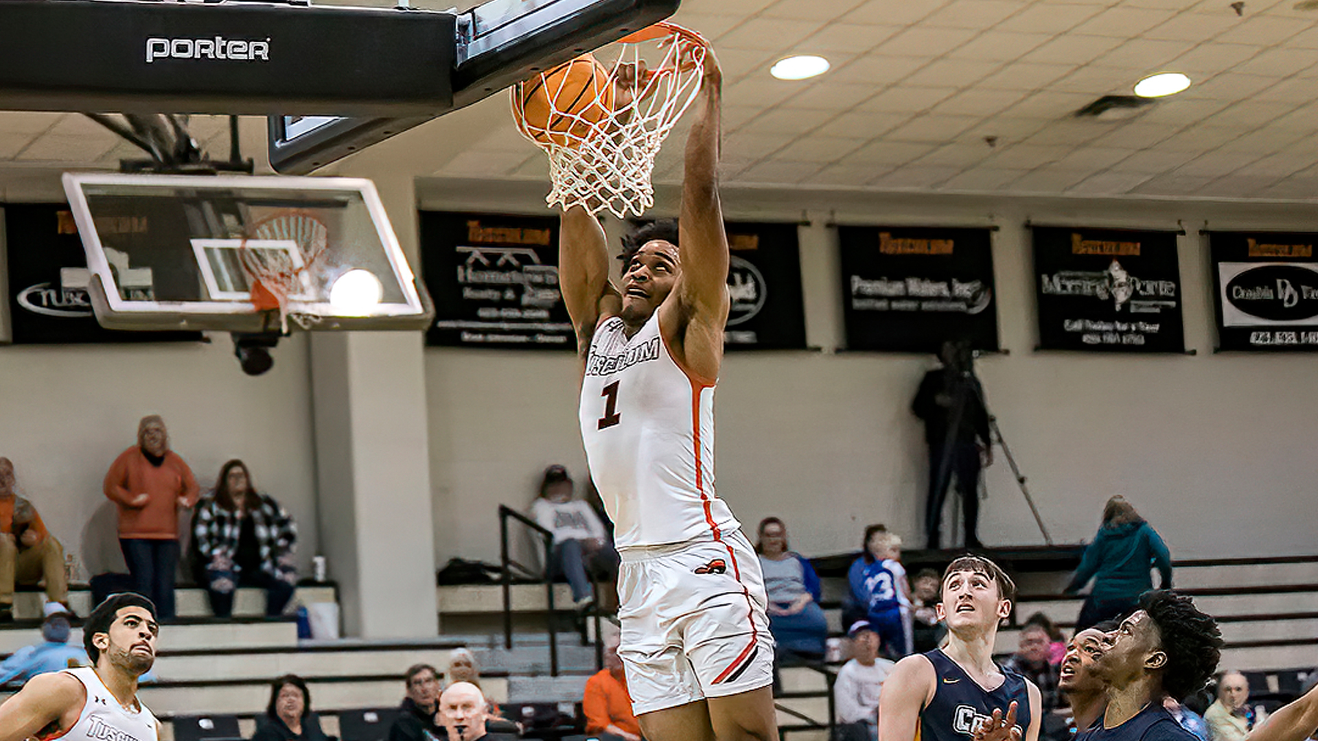 Justin Mitchell puts down this second half dunk in Tusculum's 82-72 win over Coker (photo by Chuck Williams)