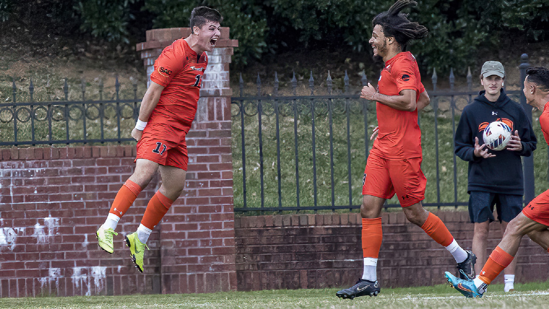 Luis De La Fuente (left) celebrates with Damien Baltide after his first-half goal against Newberry (photo by Chuck Williams)