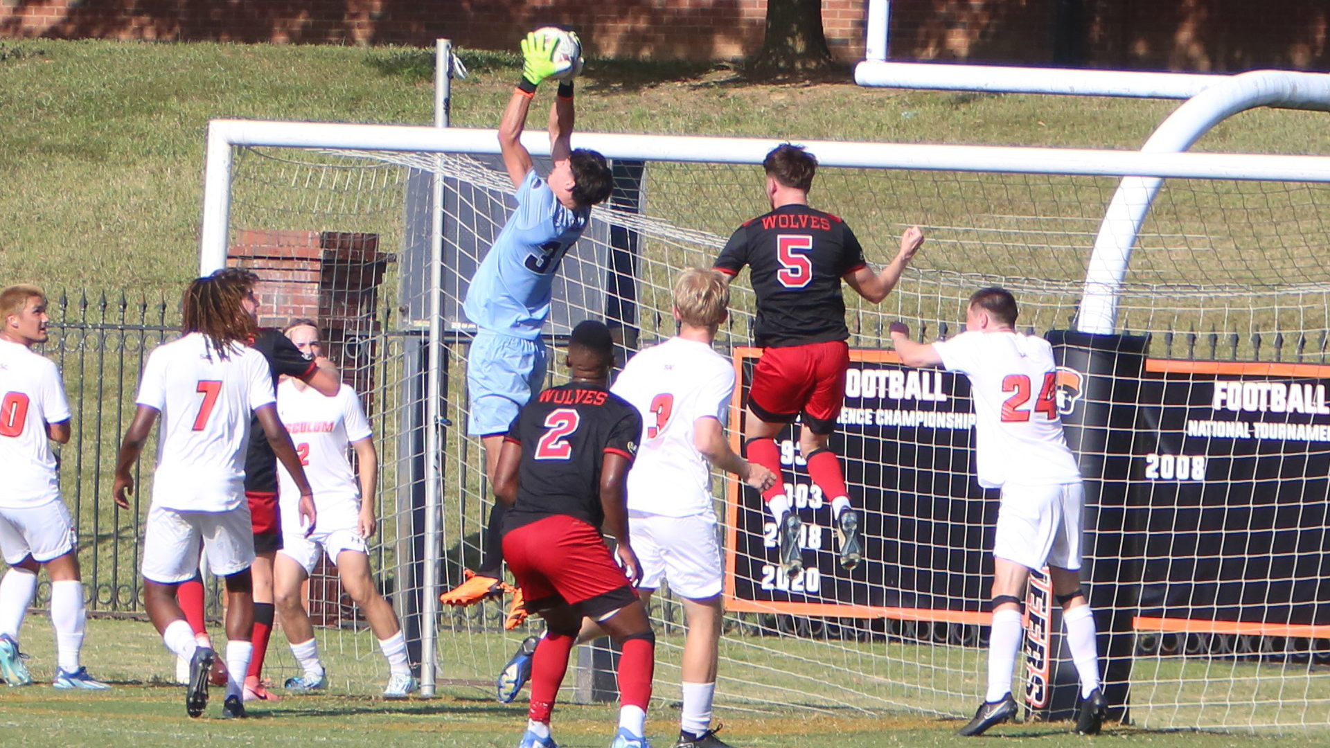 Noe Delmotte goes high to intercept a corner kick by Newberry in the first half (photo by Dom Donnelly)