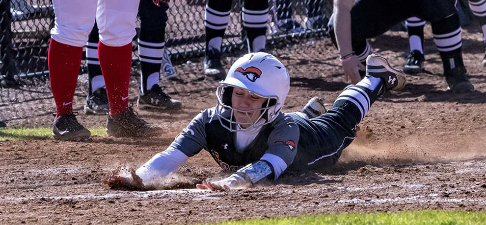 Tori West slides across with the winning run as the Pioneers rally with four runs in the seventh to beat Davis & Elkins 5-4 (photo by Chuck Williams)