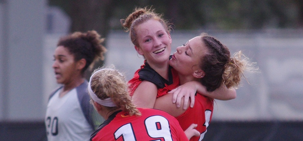 Tina Haig celebrates with Kenzie Ellenburg and Brooke Radcliffe after scoring the go-ahead goal in the 59th minute (photo by Chris Lenker)