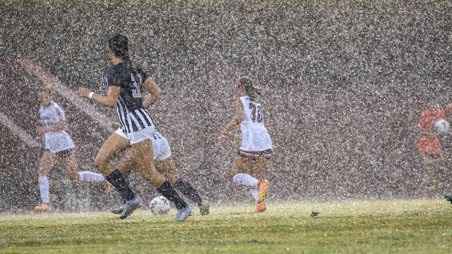 Hannah Deakins found her way through a deluge to score her first goal of the season for the Pioneers (photo by Chuck Williams)