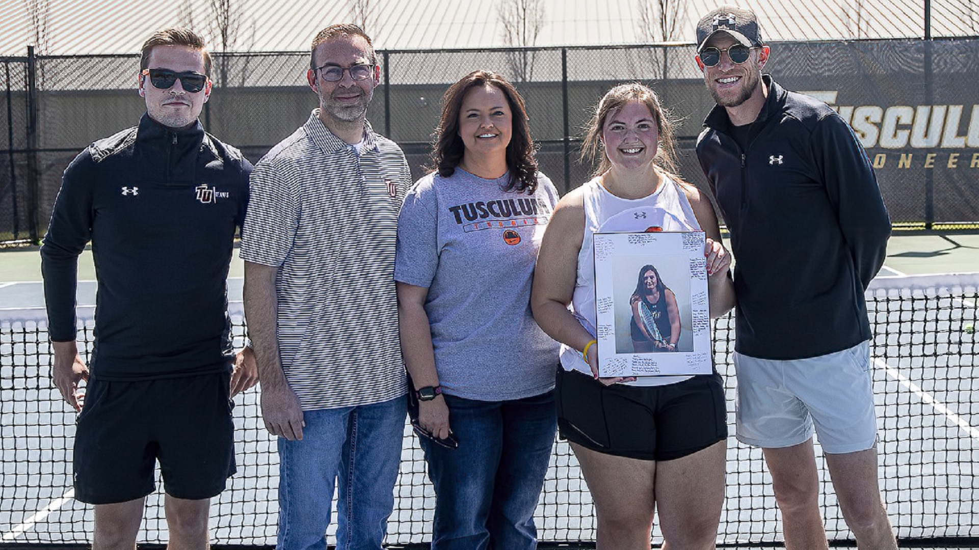 Chelsea Daugherty celebrates Senior Day with her parents, Jeff and Kaylynn, along with coaches Jacco Mensinga and Matt Frost (photo by Chuck Williams)